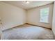 Bedroom with window and carpeting at 118 3Rd Nw Ave, Conover, NC 28613