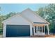 New construction home with a two-car garage and a charming covered front porch at 118 3Rd Nw Ave, Conover, NC 28613
