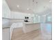 Bright kitchen features granite countertops, white cabinets, and a central island for cooking and gathering at 118 3Rd Nw Ave, Conover, NC 28613