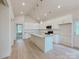 Modern kitchen with white cabinets, granite countertops, and stainless steel appliances at 118 3Rd Nw Ave, Conover, NC 28613