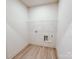 Small, dedicated laundry area equipped with utility connections and an overhead shelf for storage at 118 3Rd Nw Ave, Conover, NC 28613
