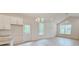 An open concept living room features light-filled windows, vaulted ceilings, and a ceiling fan at 118 3Rd Nw Ave, Conover, NC 28613