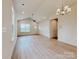 Open living room with modern light fixtures, stylish flooring, and ample natural light at 118 3Rd Nw Ave, Conover, NC 28613