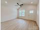 Bright living room with ceiling fan, window and modern luxury vinyl flooring at 118 3Rd Nw Ave, Conover, NC 28613