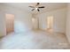 The carpeted main bedroom features a walk-in closet, ensuite bathroom, and hallway access at 118 3Rd Nw Ave, Conover, NC 28613