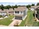 Aerial view of a two-story home in a residential neighborhood with a two-car garage and lawn at 1207 Skyflower Way, Charlotte, NC 28214