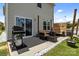 Cozy backyard patio featuring outdoor seating, grill, and decorative accents at 1207 Skyflower Way, Charlotte, NC 28214