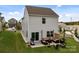 Home exterior showcasing a backyard with a patio, grill, and outdoor seating area at 1207 Skyflower Way, Charlotte, NC 28214