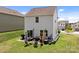 A well maintained backyard with a cozy outdoor seating area and grill, perfect for entertaining at 1207 Skyflower Way, Charlotte, NC 28214