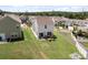 An elevated angle of a two-story home in a quiet neighborhood, featuring a charming backyard for gatherings at 1207 Skyflower Way, Charlotte, NC 28214