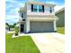 Charming two-story home with a two-car garage and well-maintained front lawn at 1207 Skyflower Way, Charlotte, NC 28214