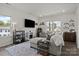 Bright living room with hardwood floors, ample seating, and an open layout, great for relaxing at 1207 Skyflower Way, Charlotte, NC 28214