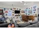Spacious recreation room with comfortable seating, bar area, and stylish decor at 1207 Skyflower Way, Charlotte, NC 28214