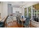 Charming dining area with large windows, hardwood floors, and seating for at least six at 12644 Lahinch Ct, Charlotte, NC 28277