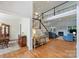 Spacious foyer with hardwood floors, featuring a staircase and offering views of the formal living room at 12644 Lahinch Ct, Charlotte, NC 28277