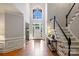 Grand entrance with hardwood floors, high ceilings, and a staircase leading to the second floor at 12644 Lahinch Ct, Charlotte, NC 28277