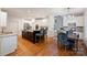 Bright kitchen featuring an island with granite countertop, stainless steel appliances, and white cabinets at 12644 Lahinch Ct, Charlotte, NC 28277
