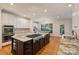 Eat-in kitchen features granite countertops, stainless steel appliances, and access to a dining area at 12644 Lahinch Ct, Charlotte, NC 28277