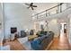 Comfortable living room area with access to the staircase and a large window for natural light at 12644 Lahinch Ct, Charlotte, NC 28277