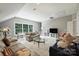 Bright and airy living room with a large window providing natural light and a comfortable, inviting space at 12644 Lahinch Ct, Charlotte, NC 28277