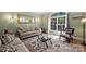 Inviting living room with a large window, elegant furnishings, and stylish decor at 12644 Lahinch Ct, Charlotte, NC 28277