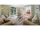 Cozy living room with a window that brings lots of natural light and views to the beautiful outdoors at 12644 Lahinch Ct, Charlotte, NC 28277