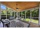 Inviting screened porch with ceiling fan and comfortable seating offers a relaxing outdoor living space at 12644 Lahinch Ct, Charlotte, NC 28277
