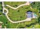 Aerial view showcasing the expansive property, manicured lawns, and serene in-ground swimming pool at 14041 Mccord Rd, Huntersville, NC 28078