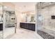 Luxurious bathroom featuring marble tile, double vanity, and glass enclosed shower at 14041 Mccord Rd, Huntersville, NC 28078