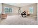 Bedroom with natural light, neutral walls, plush carpet, and stylish window shutters at 14041 Mccord Rd, Huntersville, NC 28078