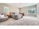Bright bedroom with natural light, neutral walls, plush carpet, and stylish furniture at 14041 Mccord Rd, Huntersville, NC 28078