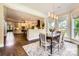 Open-concept layout with dining room flowing into the kitchen, filled with natural light at 14041 Mccord Rd, Huntersville, NC 28078