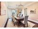 Formal dining room with elegant chandeliers, decorative wallpaper, and a large table for entertaining guests at 14041 Mccord Rd, Huntersville, NC 28078