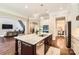 Gourmet kitchen with a center island, bar seating, and seamless flow to adjacent living spaces for easy entertaining at 14041 Mccord Rd, Huntersville, NC 28078