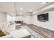 Finished basement living room with luxury vinyl floors, entertainment area, and cozy furniture at 14041 Mccord Rd, Huntersville, NC 28078