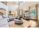 Bright living room featuring a fireplace, hardwood floors, and comfortable seating at 14041 Mccord Rd, Huntersville, NC 28078