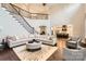 Open-concept living room featuring hardwood floors and seamless transition into the kitchen at 14041 Mccord Rd, Huntersville, NC 28078