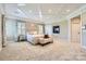 Spacious main bedroom with fireplace, sitting area, neutral decor, and ample natural light at 14041 Mccord Rd, Huntersville, NC 28078
