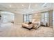 Spacious main bedroom with coffered ceilings, sitting area, and ample natural light at 14041 Mccord Rd, Huntersville, NC 28078