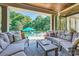 Inviting covered patio with comfortable seating, perfect for outdoor relaxation and entertaining near the pool at 14041 Mccord Rd, Huntersville, NC 28078