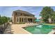 Back of house featuring a sparkling in-ground pool and manicured lawn, perfect for outdoor enjoyment at 14041 Mccord Rd, Huntersville, NC 28078