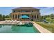 Stunning backyard featuring a sparkling pool, sun loungers, and inviting outdoor seating areas at 14041 Mccord Rd, Huntersville, NC 28078