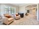 Cozy sitting room with two armchairs, wet bar, plantation shutters, and neutral decor at 14041 Mccord Rd, Huntersville, NC 28078