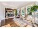 Bright sunroom with views of the pool, featuring stylish seating and elegant decor at 14041 Mccord Rd, Huntersville, NC 28078
