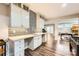 Basement wet bar with custom cabinets, decorative backsplash, and undermount sink at 14041 Mccord Rd, Huntersville, NC 28078