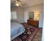 View of bedroom with a ceiling fan, dresser, and carpet at 14608 Waterside Dr, Charlotte, NC 28278
