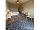 Bedroom with ceiling fan, hardwood floors and an area rug at 14608 Waterside Dr, Charlotte, NC 28278
