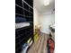 Walk-in closet with custom shelving and wood floor at 14608 Waterside Dr, Charlotte, NC 28278
