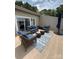Outdoor living area with comfortable seating and an umbrella for shade at 14608 Waterside Dr, Charlotte, NC 28278