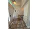 Inviting entryway with tiled floors, stairs, and natural light from the sidelight at 14608 Waterside Dr, Charlotte, NC 28278